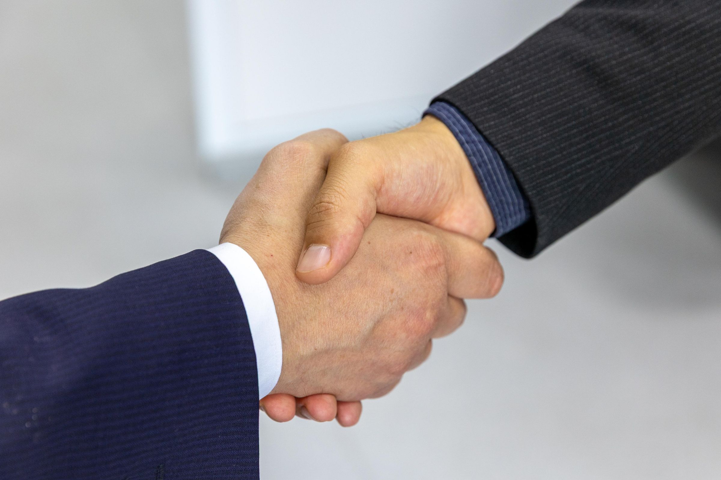 Working meeting between investors reviewing a real estate project
